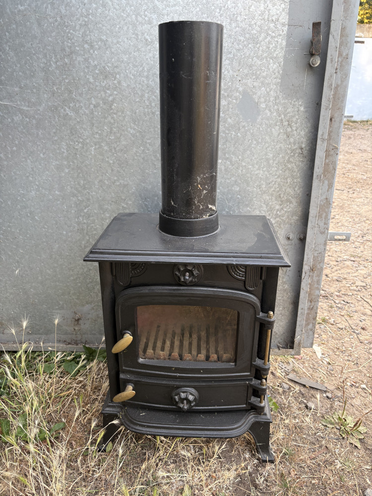 Small heavy log burner make a great garden piece