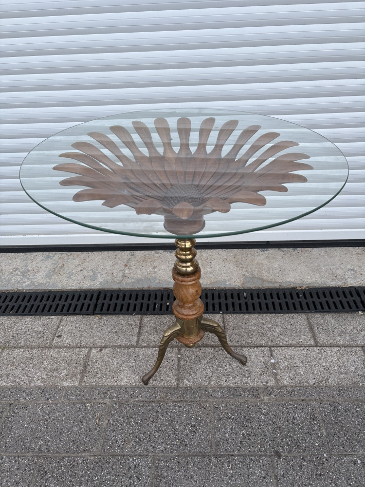 Beautiful brass footed table with glass top, wood been glued as shown