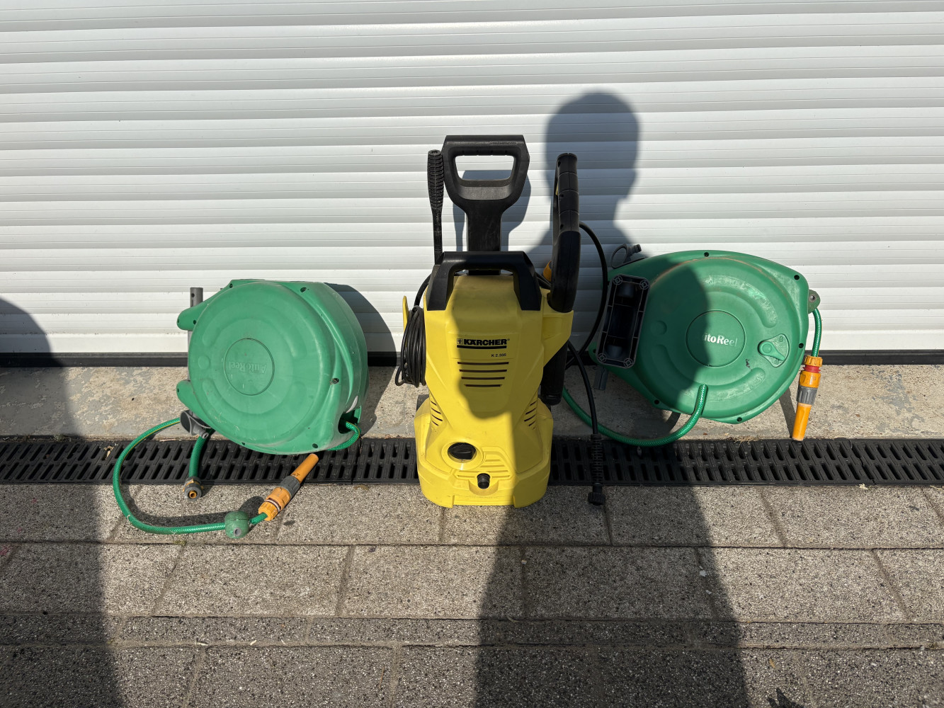 Two hose reels and Karcher, Karcher looks like missing an attachment check picture