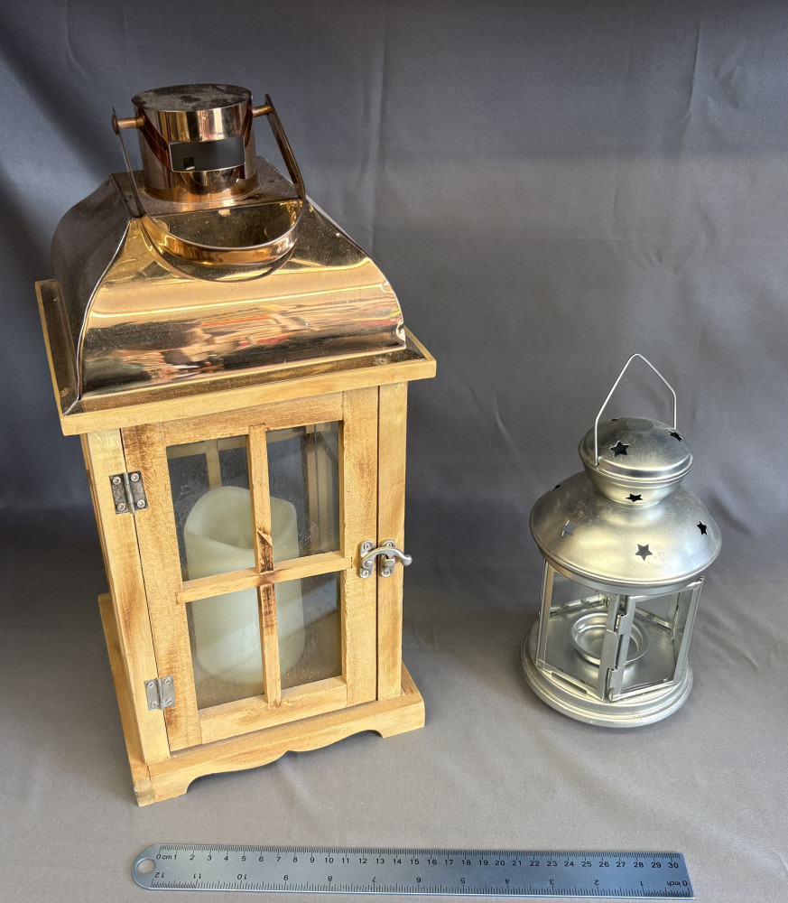2 garden lanterns one large wooden one the other metal