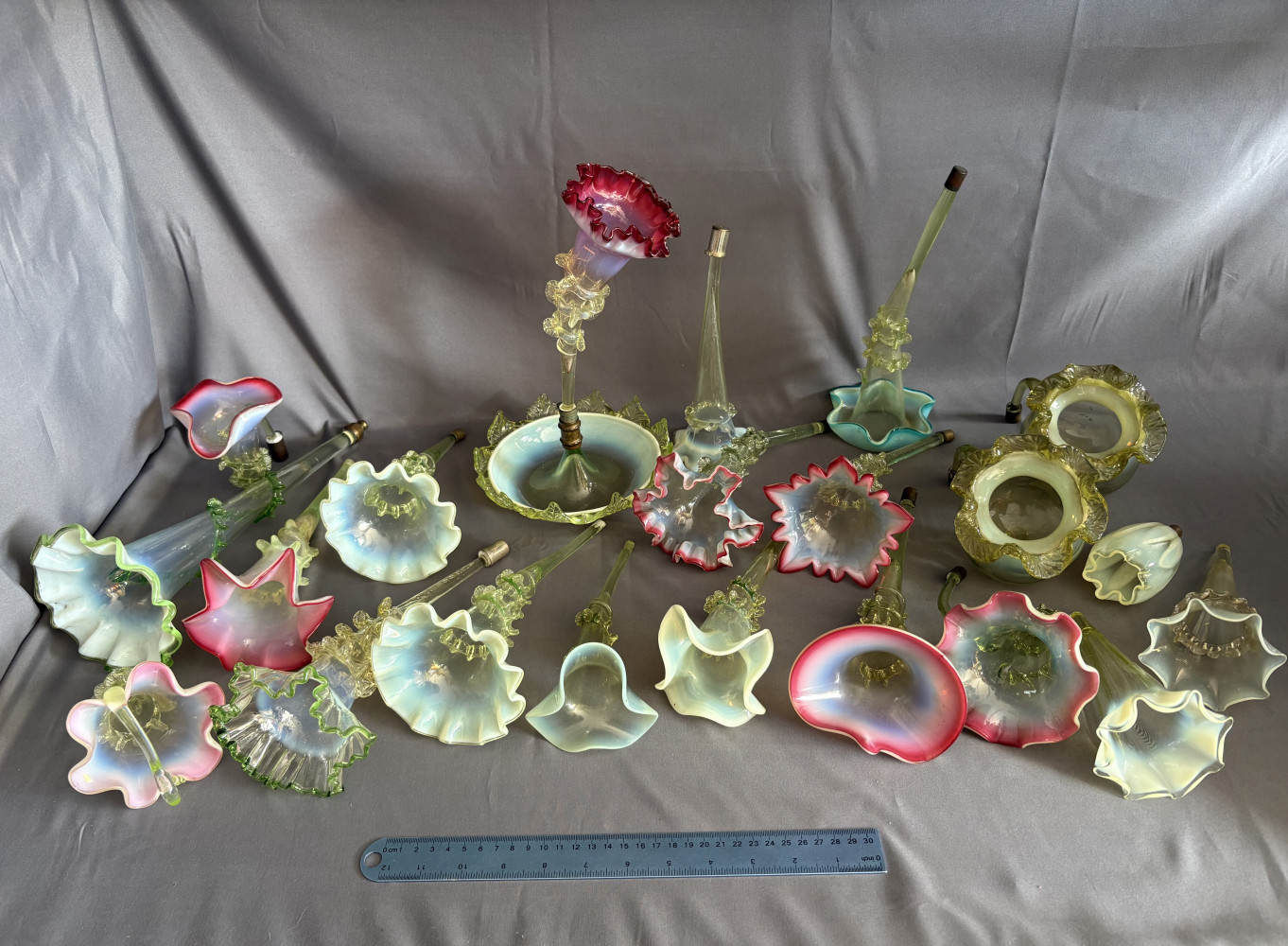 Large mixed lot of Victorian-era Epergne stems made from Vaseline Uranium glass.