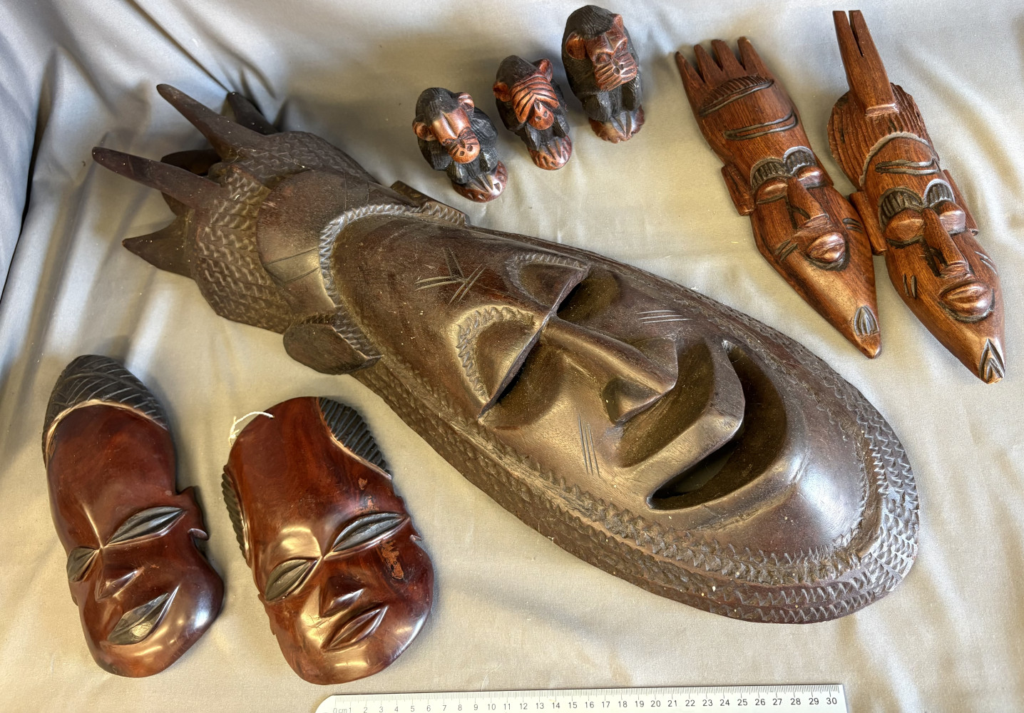 Mixed lot of wooden masks including large tribal mark 67cms long