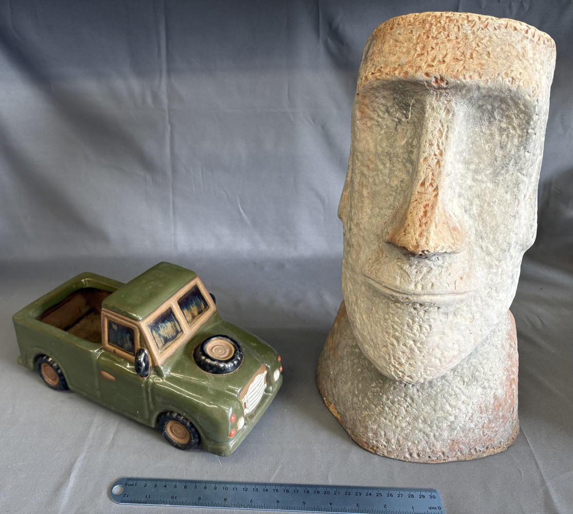 Easter Island head garden ornament and Land Rover ceramic garden pot