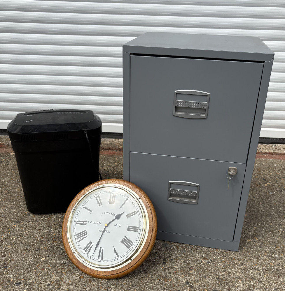 Metal filing cabinet with key, clock and paper shredder
