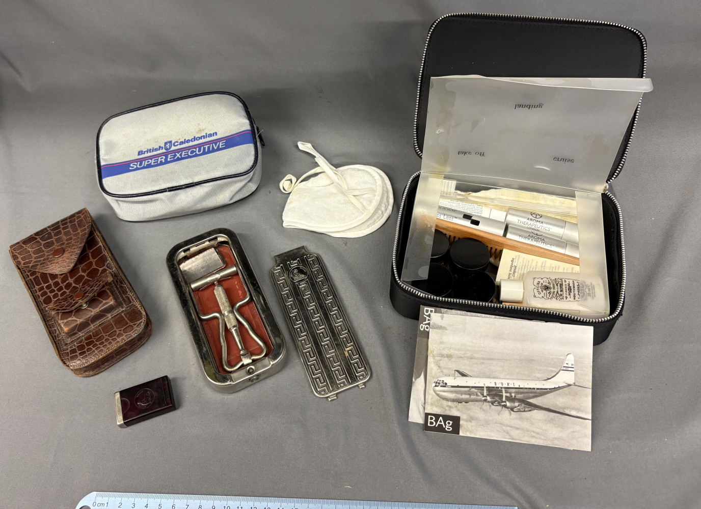 Vintage travel razor and two British Airways collectible travel bags,