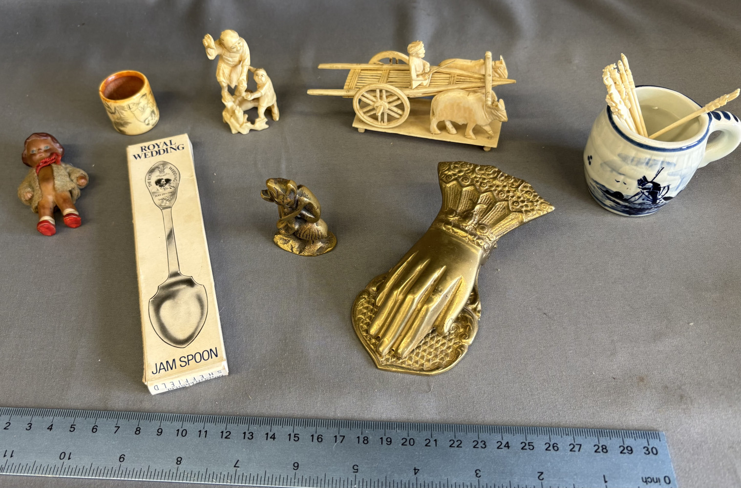 Brass items including clip, royal spoon and other items made from bone or plastic