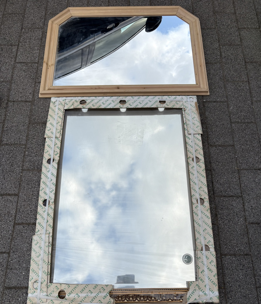 Two Mirrors ornate one in gold frame never been unwrapped 112cms x 90 cms and pale frame wooden one 102 cms x 72cms