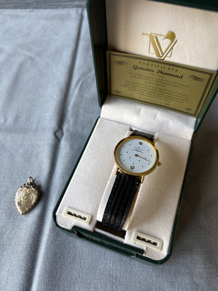3.5 gram heart locket stamped 9ct Gold back and front, and gold plated watch in box