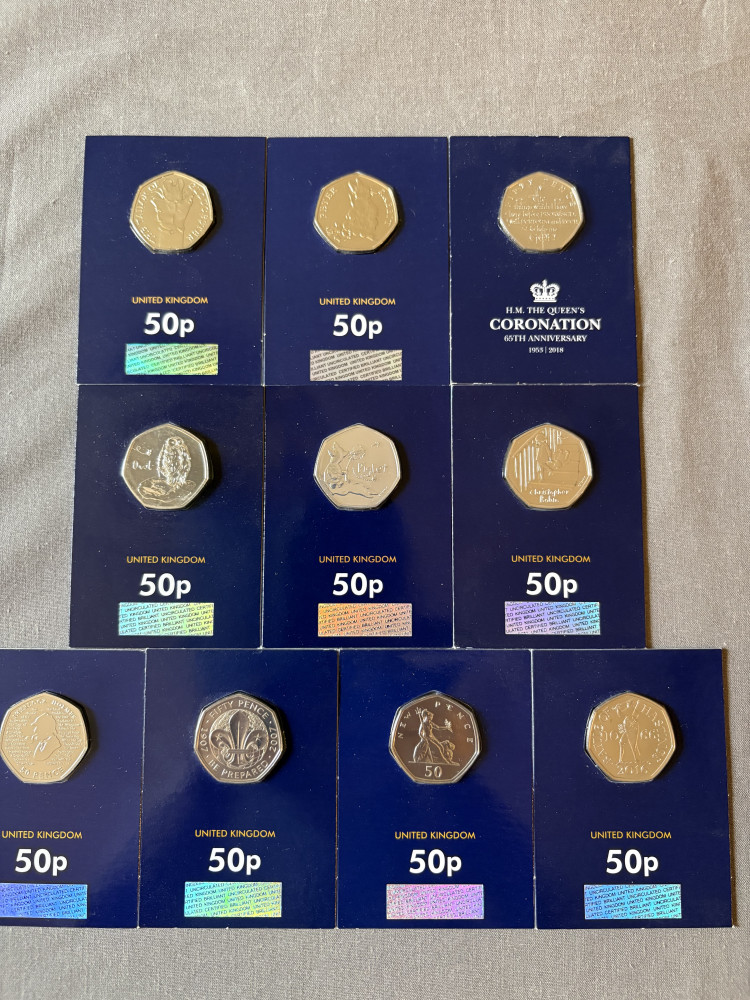 Uncirculated collectable 50ps, Peter Rabbit, Sherlock Holmes, 100th Anniversary Scout, Owl (Winnie the Pooh), The Tailor of Gloucester, Piglet, 1066 battle of Hastings 2016, Christopher Robin 2018 Isle of Man 50 Pence Coronation Oath and Britannia