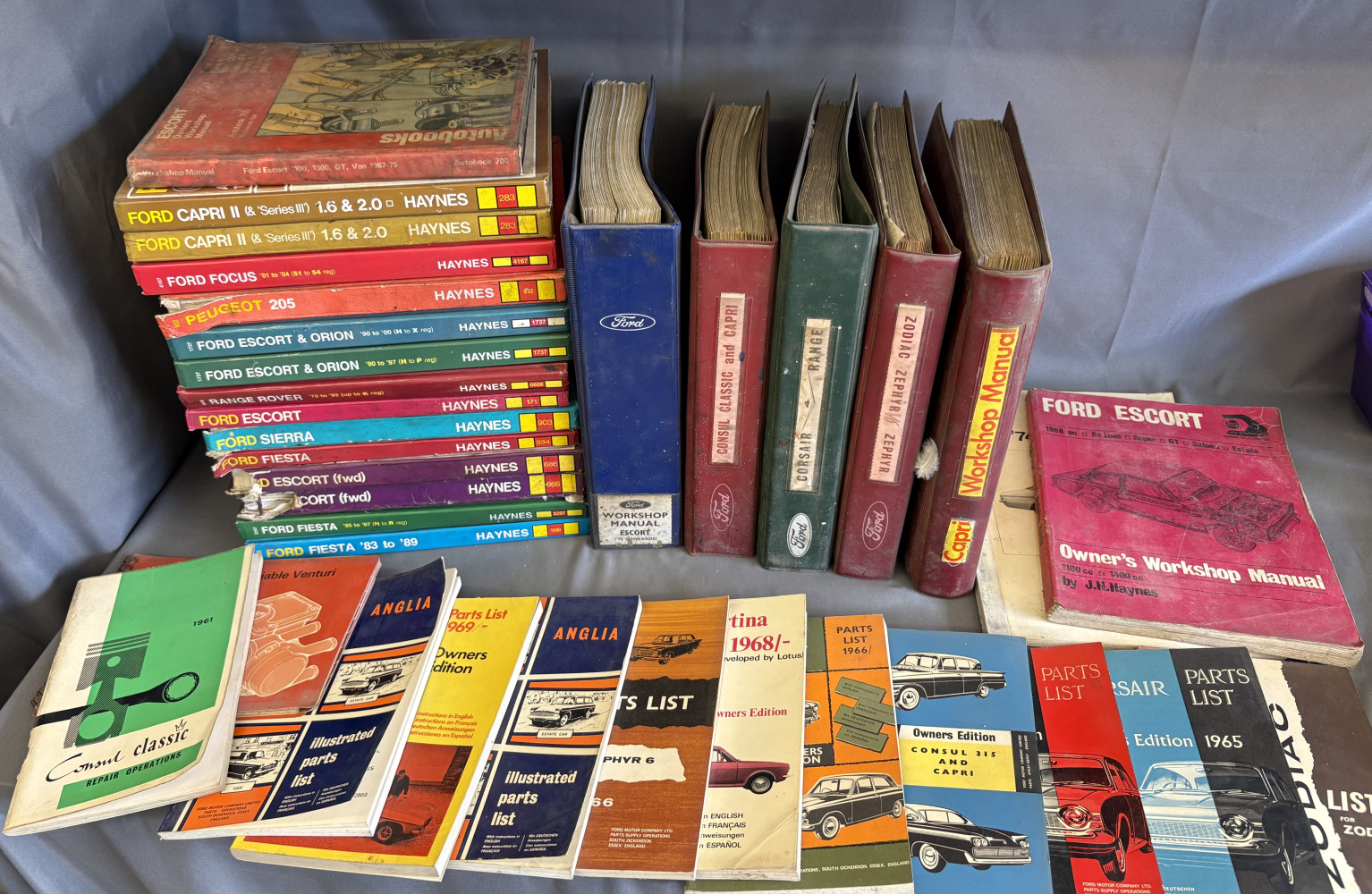 Large lot of Haynes Manuals and other automotive books including rare Fords literature .