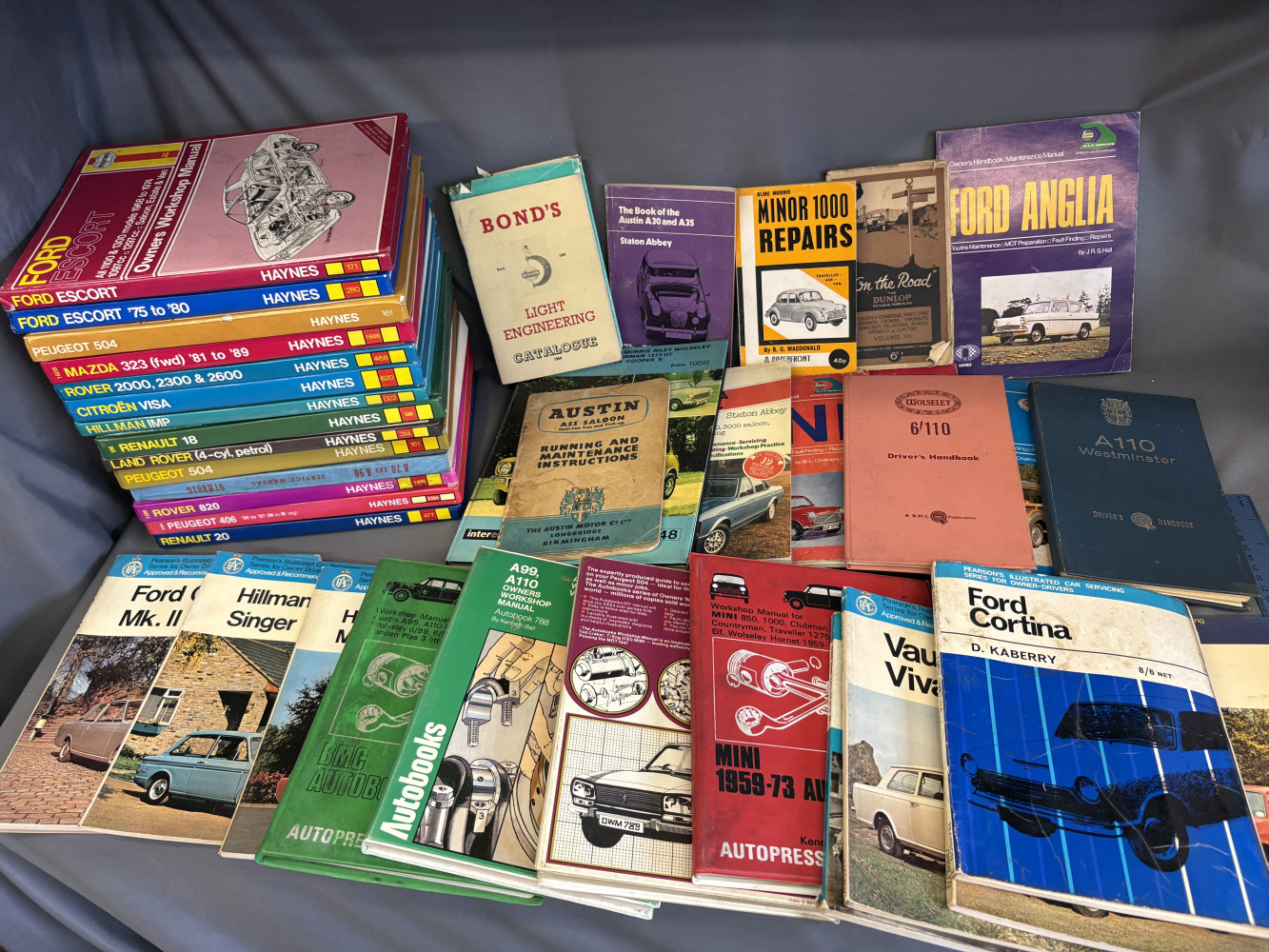 Large lot of Haynes manuals in good condition and other automotive books