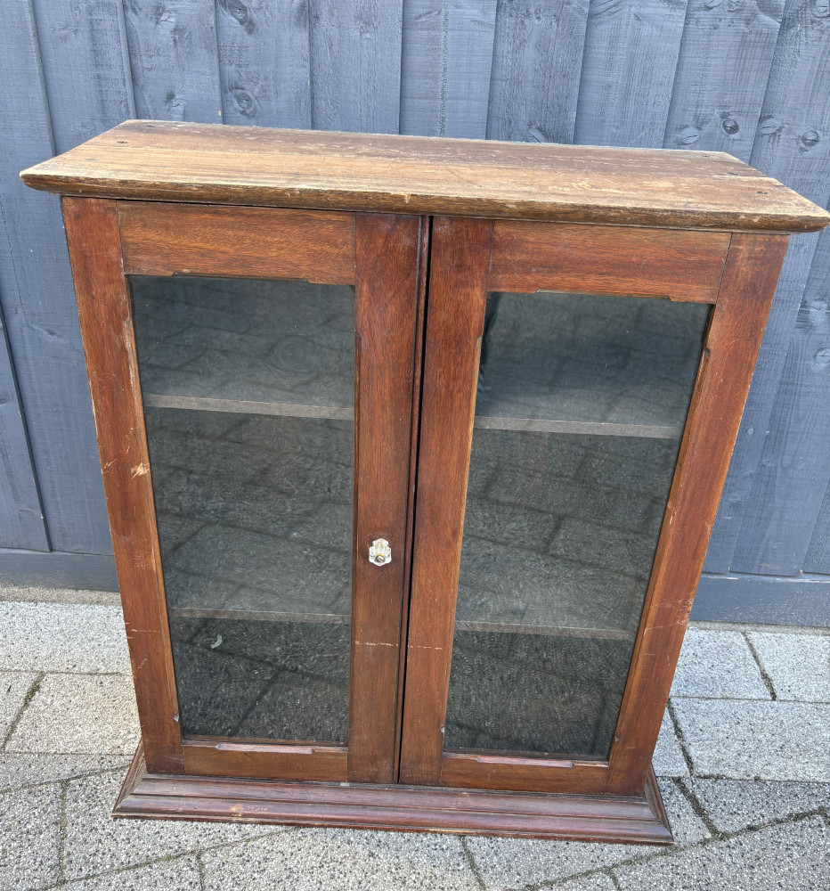 Glass fronted display cabinet with movable shelves