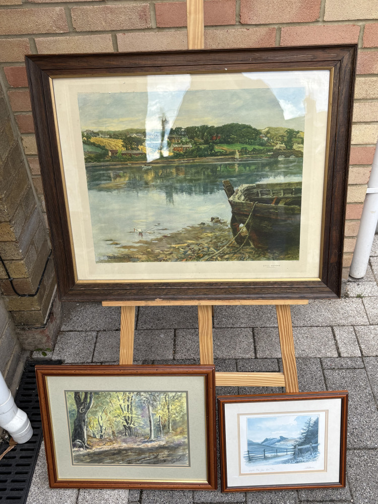 Three framed pictures and prints, largest one called “Still Waters”