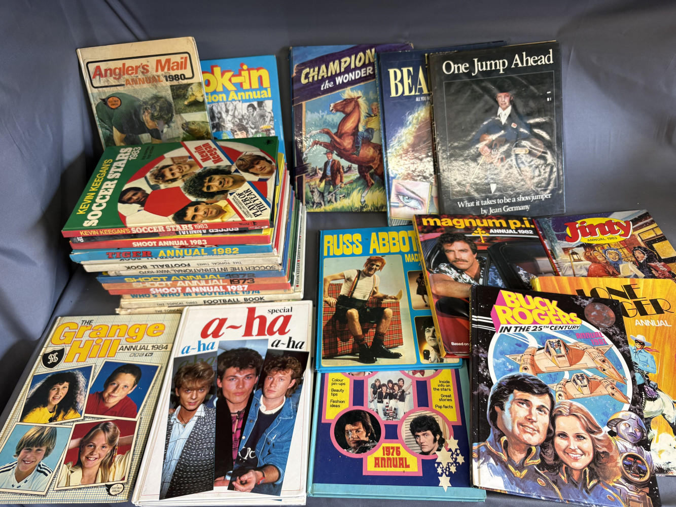 Vintage collection of 1970s and 1980s children's and teen annuals, music, football and others