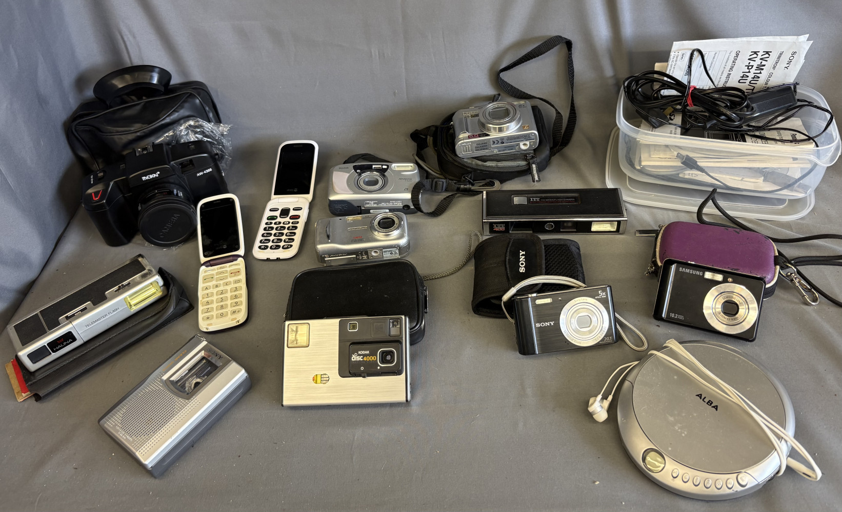 Digital cameras, cd player, cameras, manuals, dictaphone and old phones