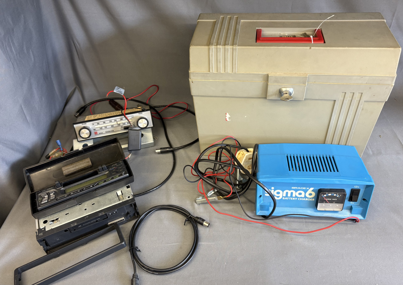 Battery charger, radios and box with lock