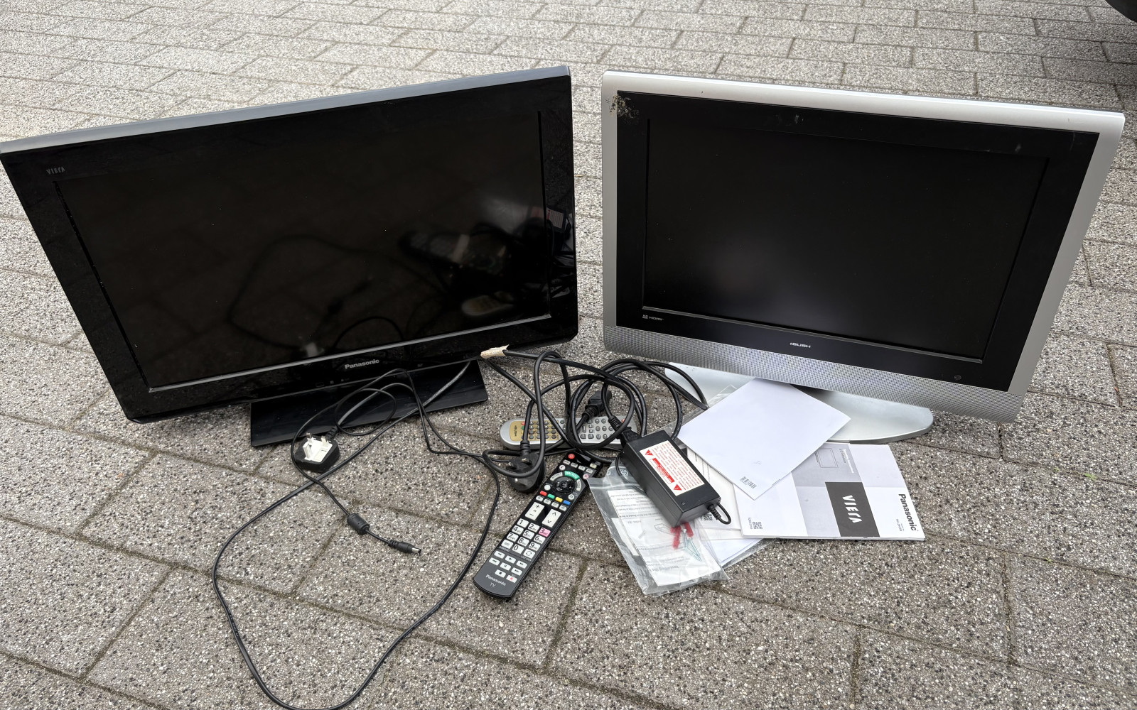 2 TVs with remotes and instructions