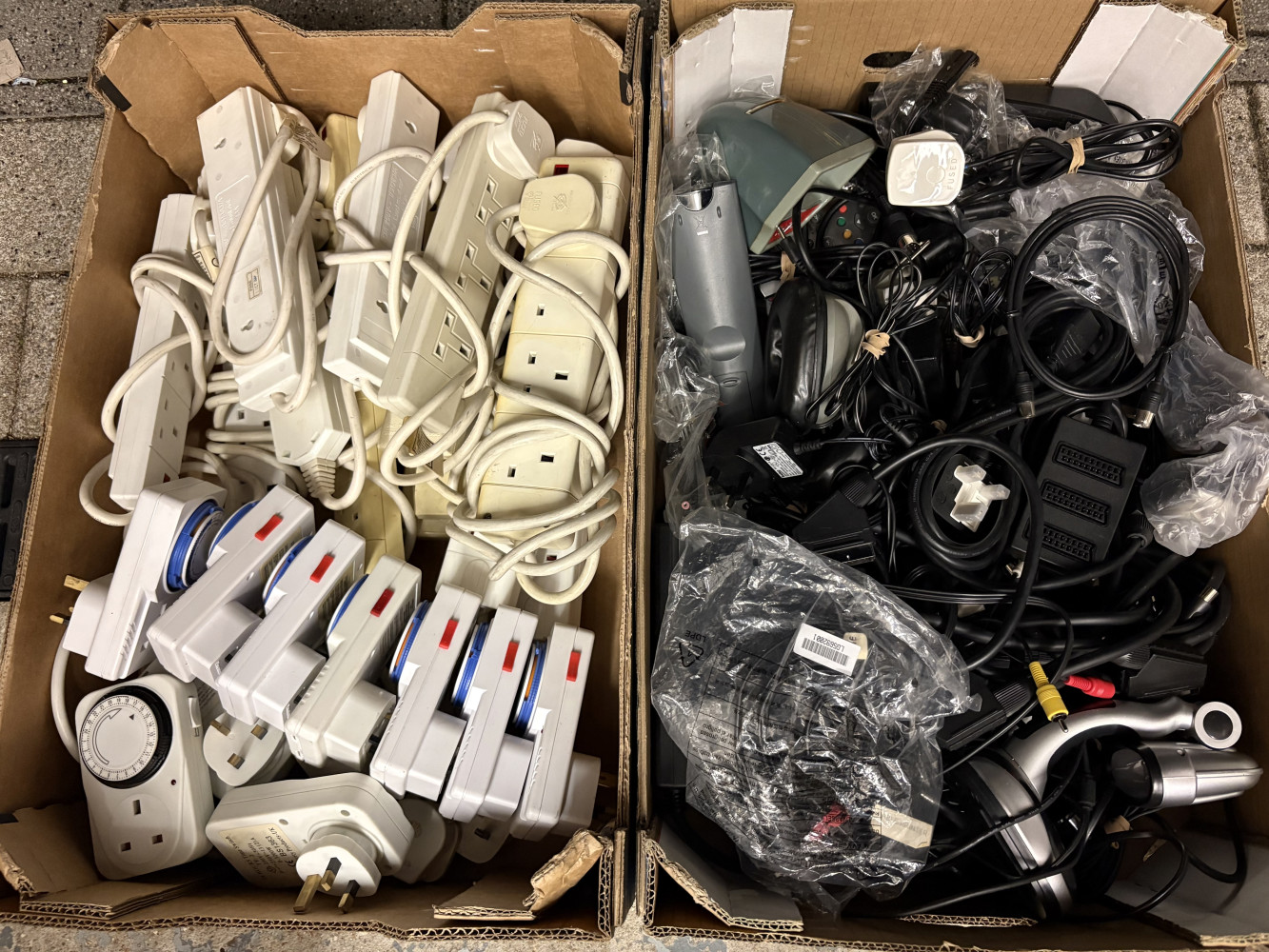 2 large crates of extension leads, timers and loads of other leads