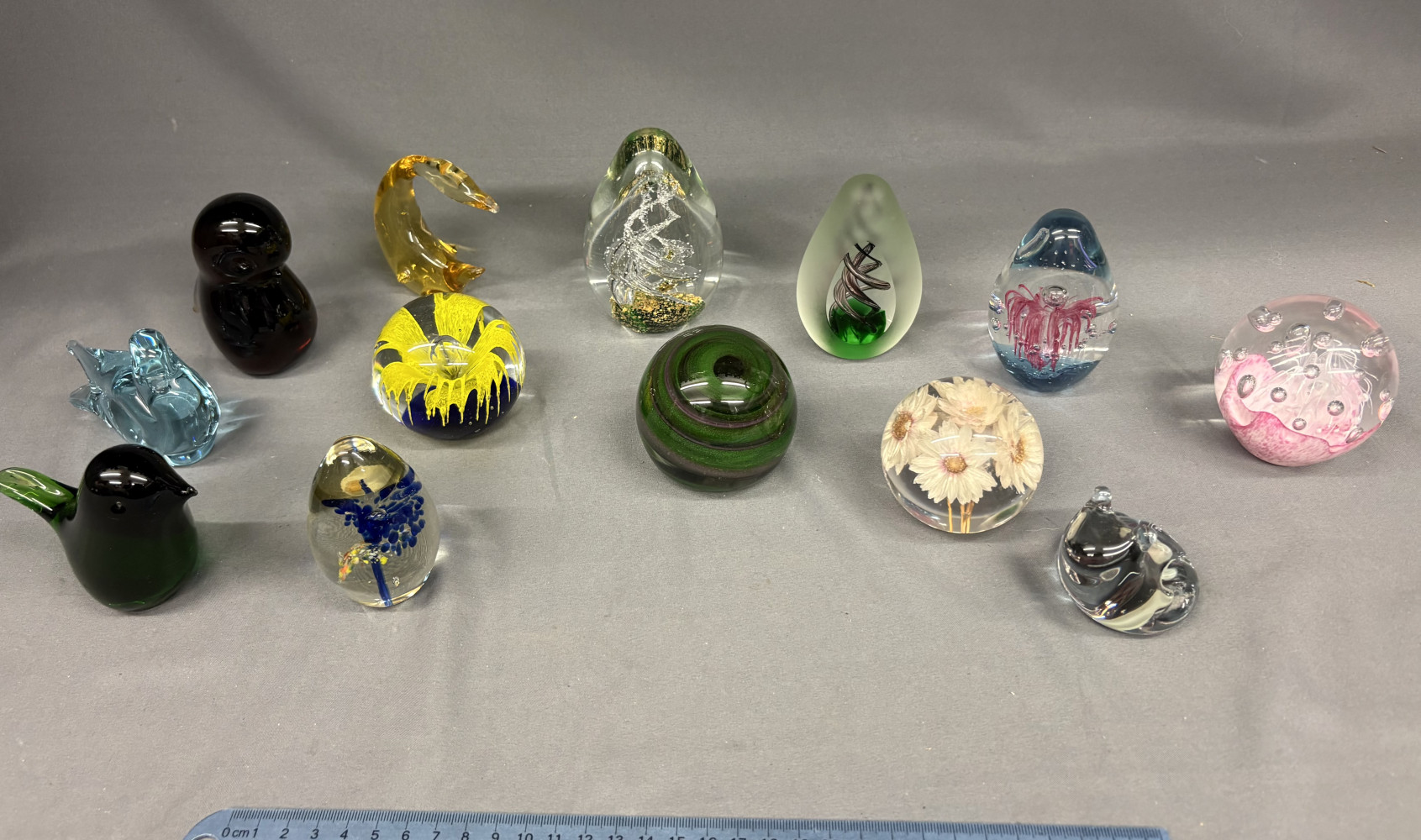 Collection of paper weights some in animal form
