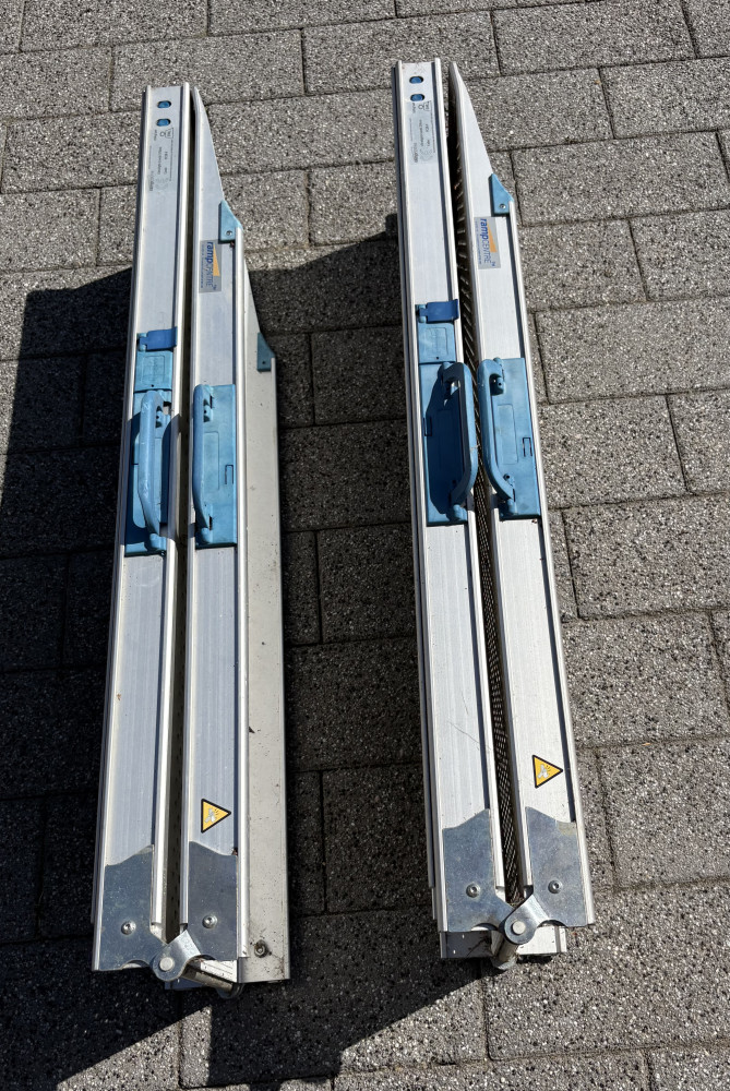 Two folding wheel chair or bike ramps 2m long