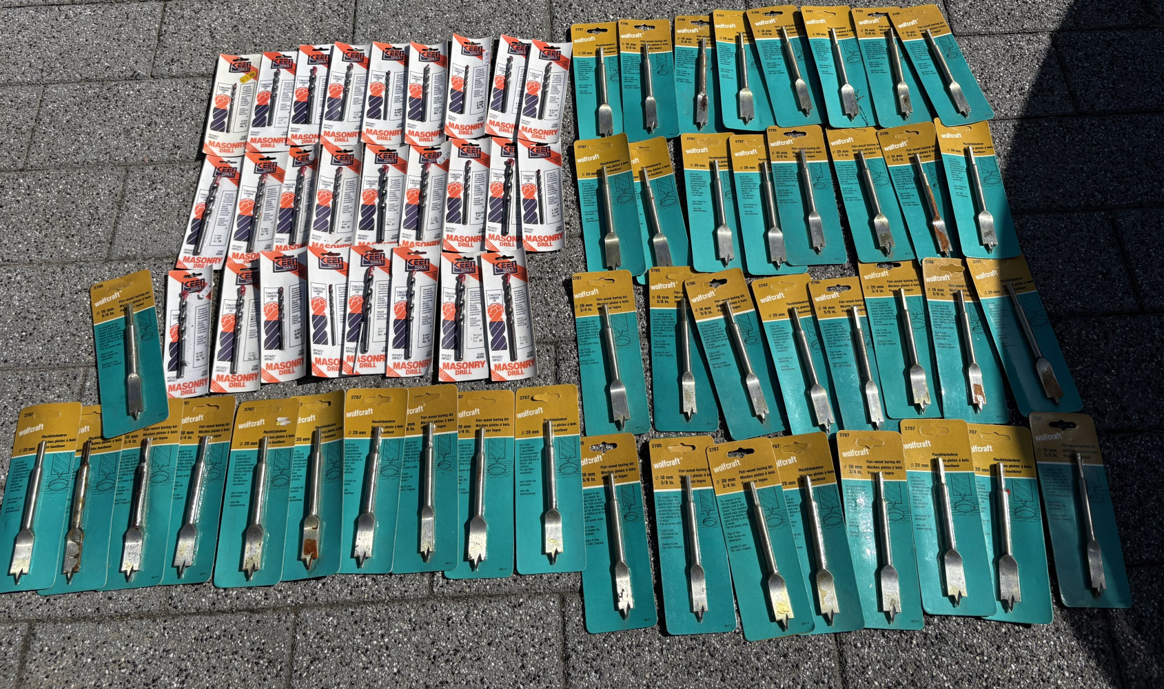 26 masonry drill bits and 43 wooden flat bits