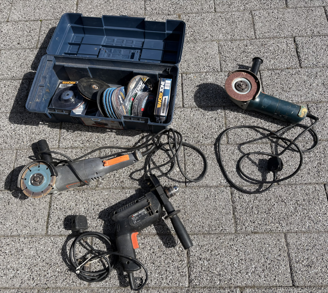 Box of cutting discs, two grinders and drill