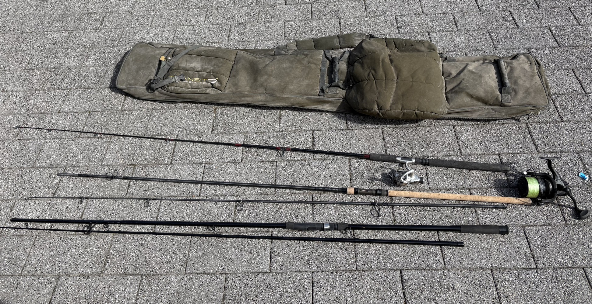 Fishing bag in need of TLC with 3 rods and 2 fishing reels