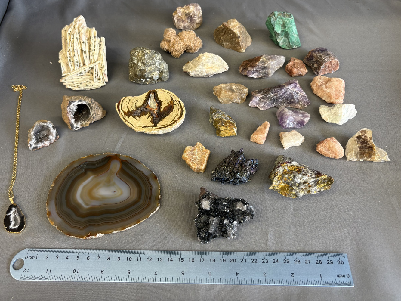 Assorted collection of rough and polished mineral, crystal, and gemstone specimens