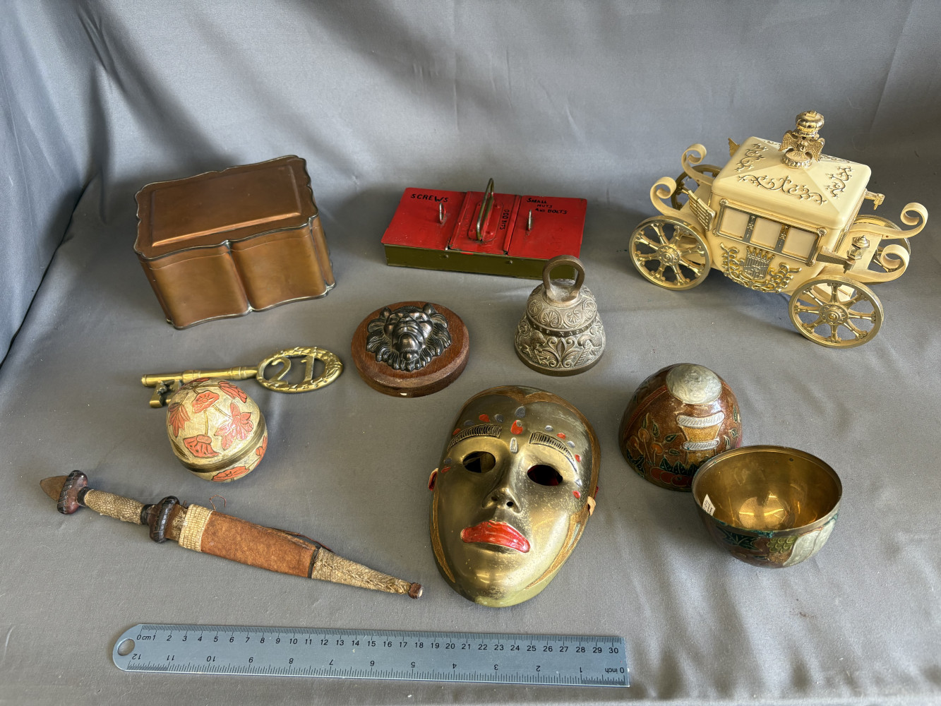 Brass Mask, copper tea caddy or tobacco tin, brass eggs, musical coach jewellery box and other metal ware items