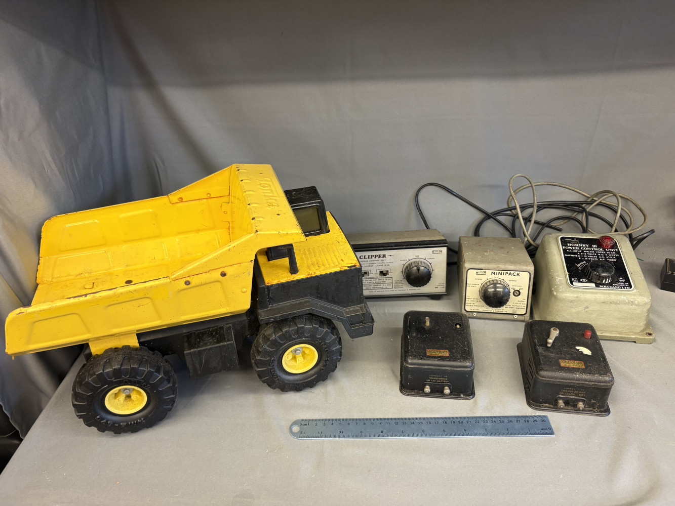 Tonka pressed-steel dump truck and Various controllers including Hornby and H & M