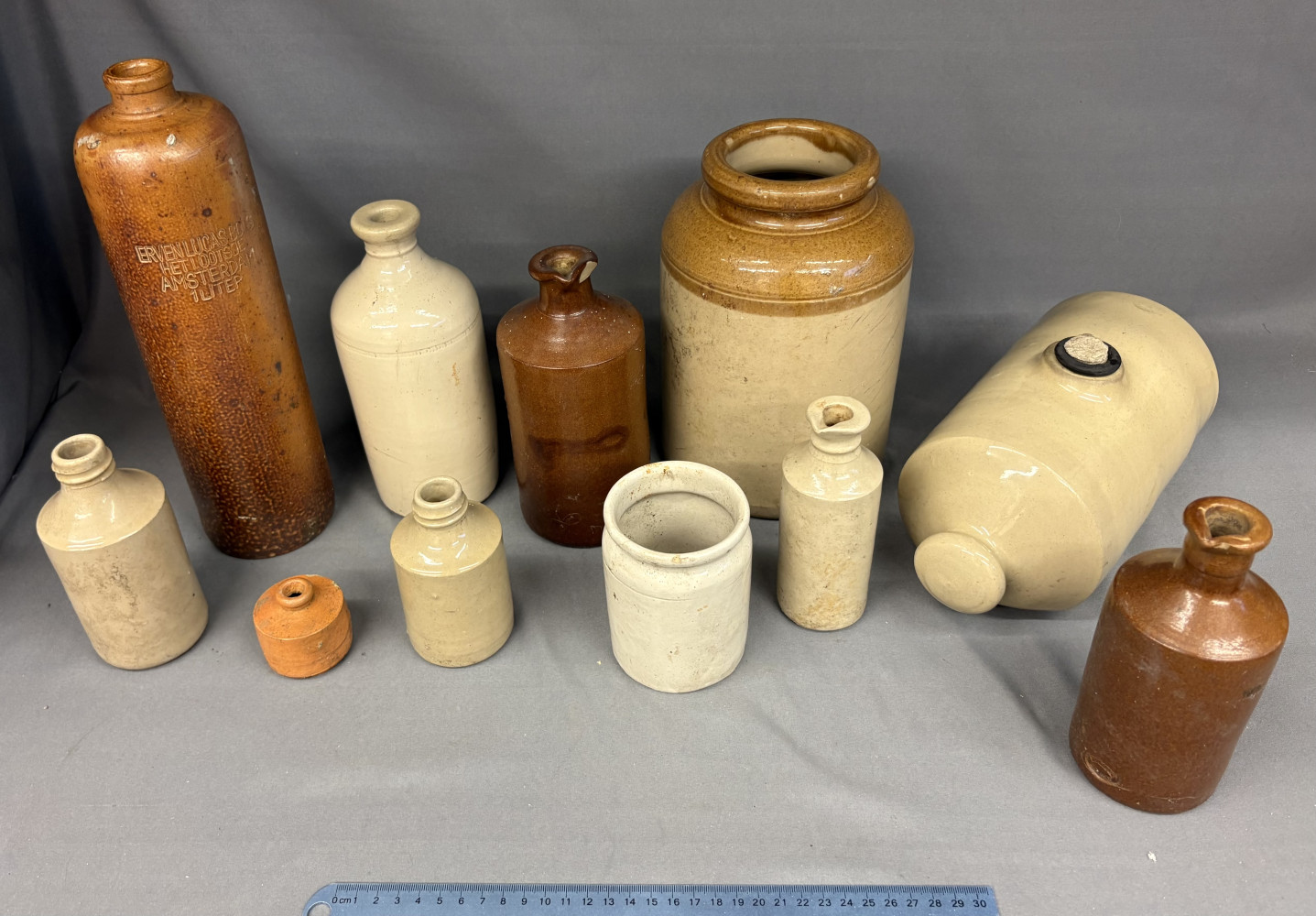 Collection of vintage stoneware bottles and jars