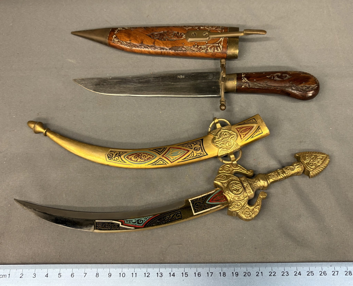 Decorative curved Moroccan dagger and Indian souvenir dagger