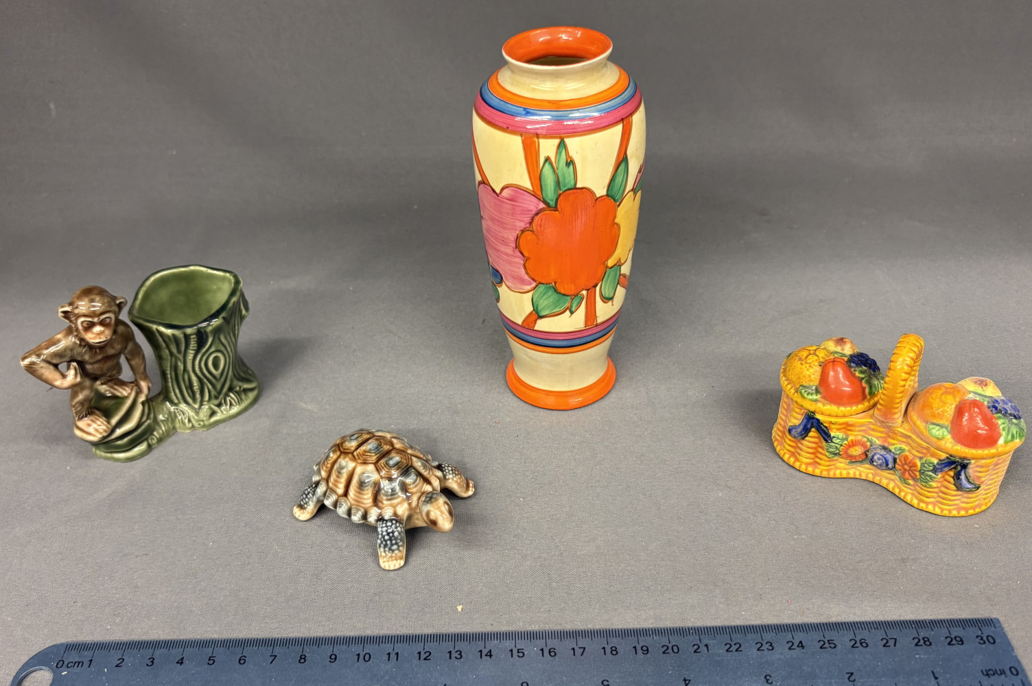 Clarice Cliff hand-painted "Fantasque Bizarre” Vase, chip on base and crack on back as shown in pictures, wade items and salt and pepper set