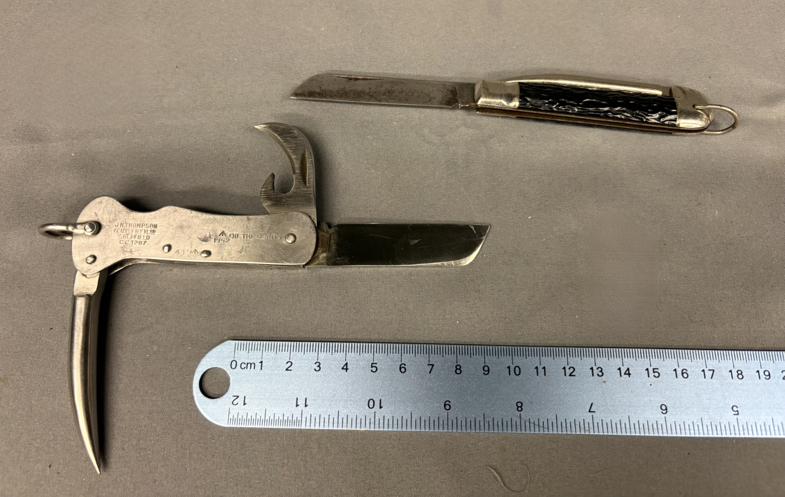 British military folding pocket knife made by J.H. Thompson (Cutlery) Ltd. in Sheffield, dated 1952 and a black handled vintage folding pocket knife