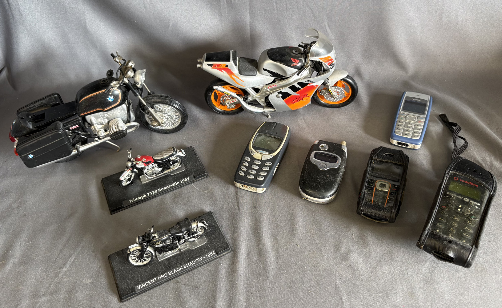 Display model motorbikes and lot of mobile phones