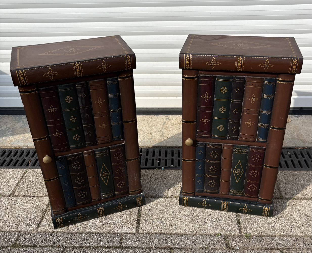 Pair of vintage-style faux-leather book cabinets or side tables with hidden interior storage Both full of CDs one door slightly out of shape as shown in last picture