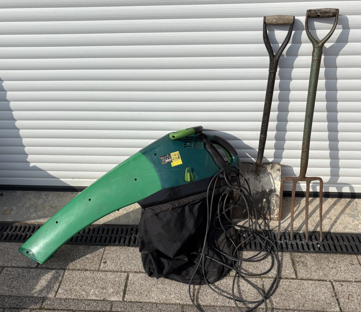 Working leaf blower and spade and garden fork