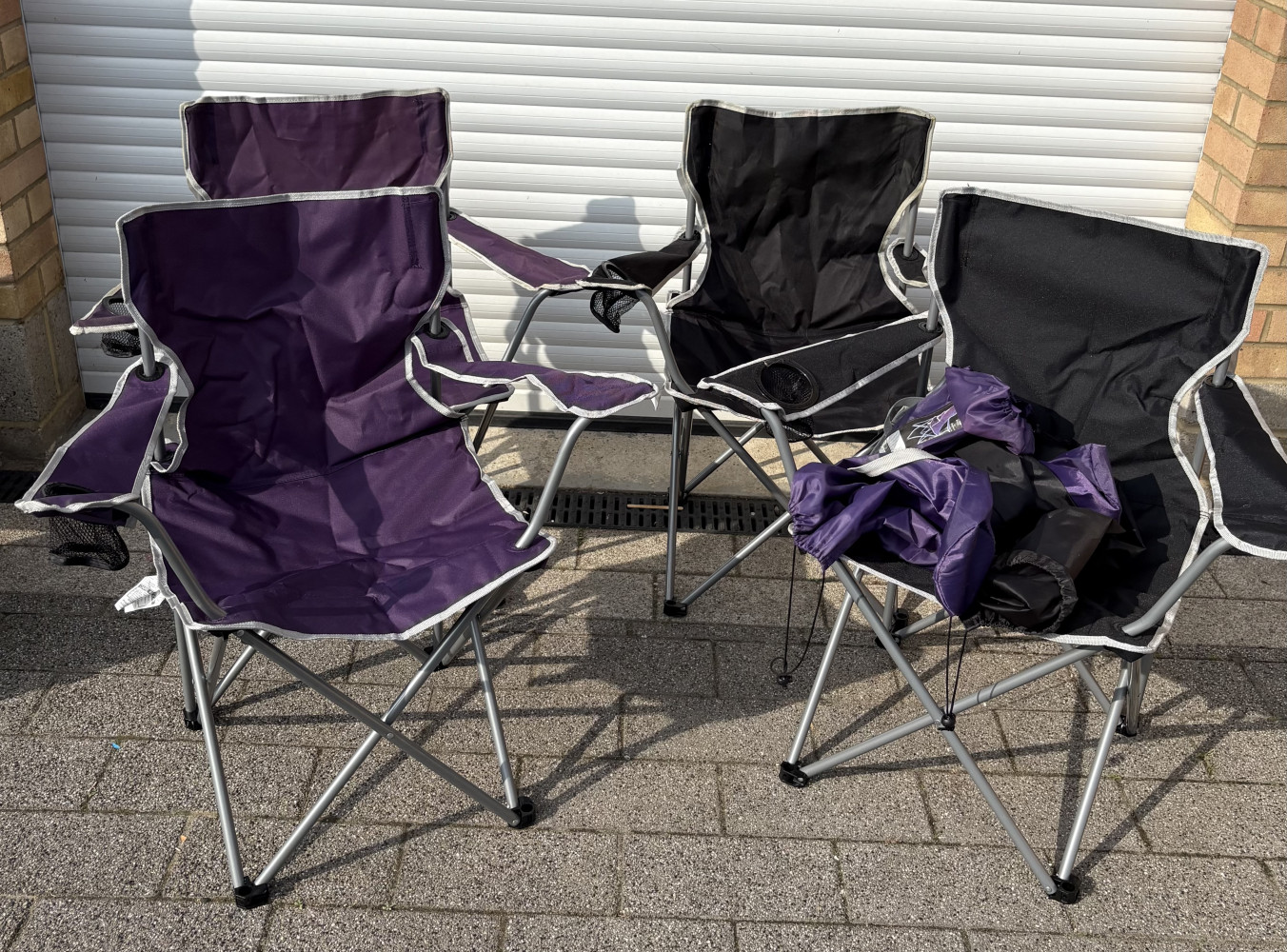 Four camping chairs with bags
