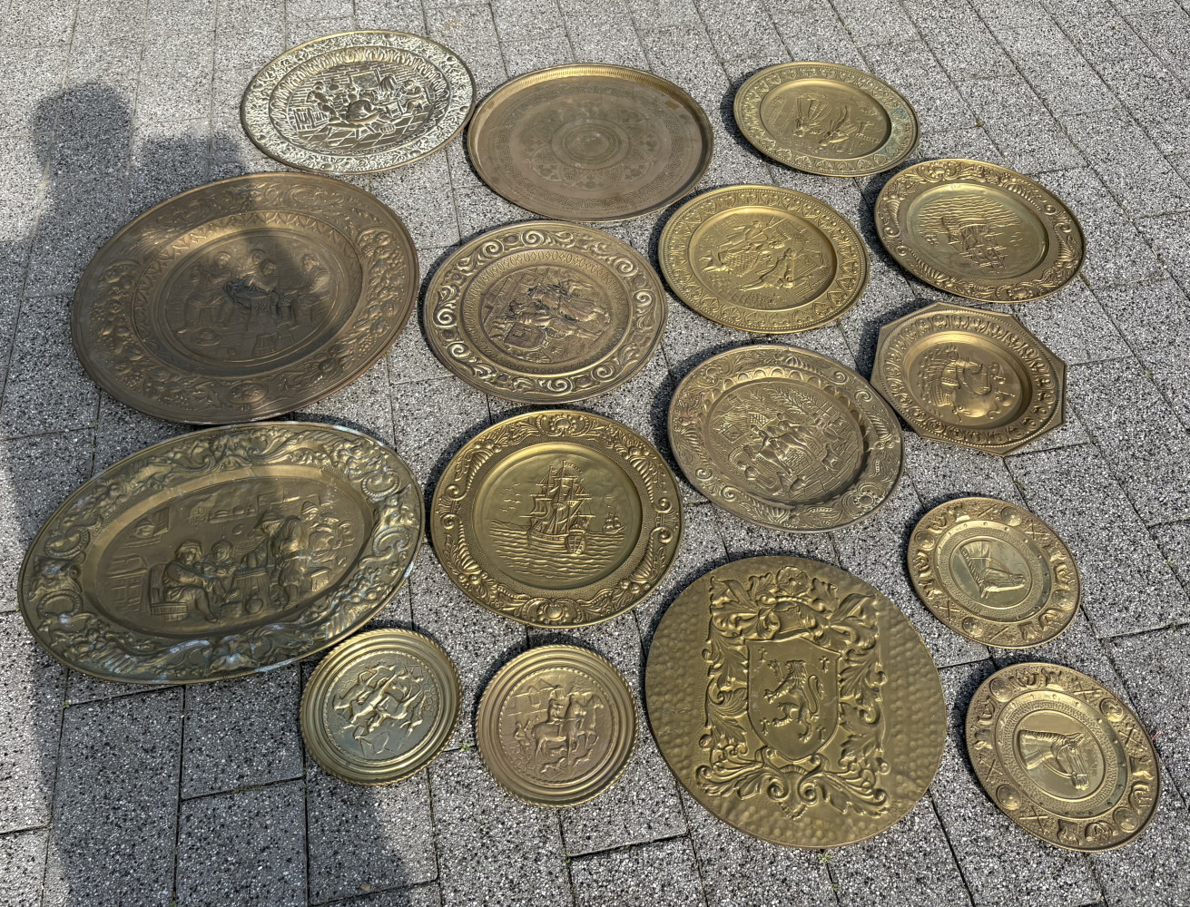 Large lot of brass wall plates, approx 7kgs of brass one has a wooden back