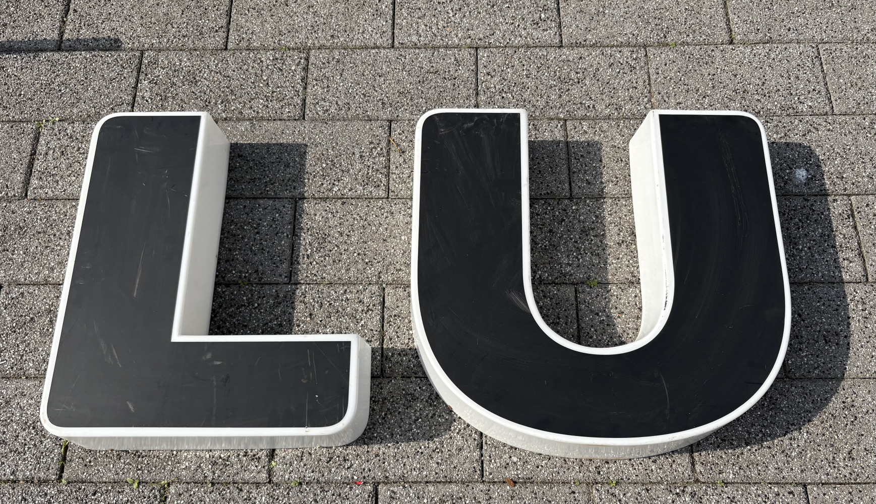 Large plastic L and U letters, L is approx 59x43 cms