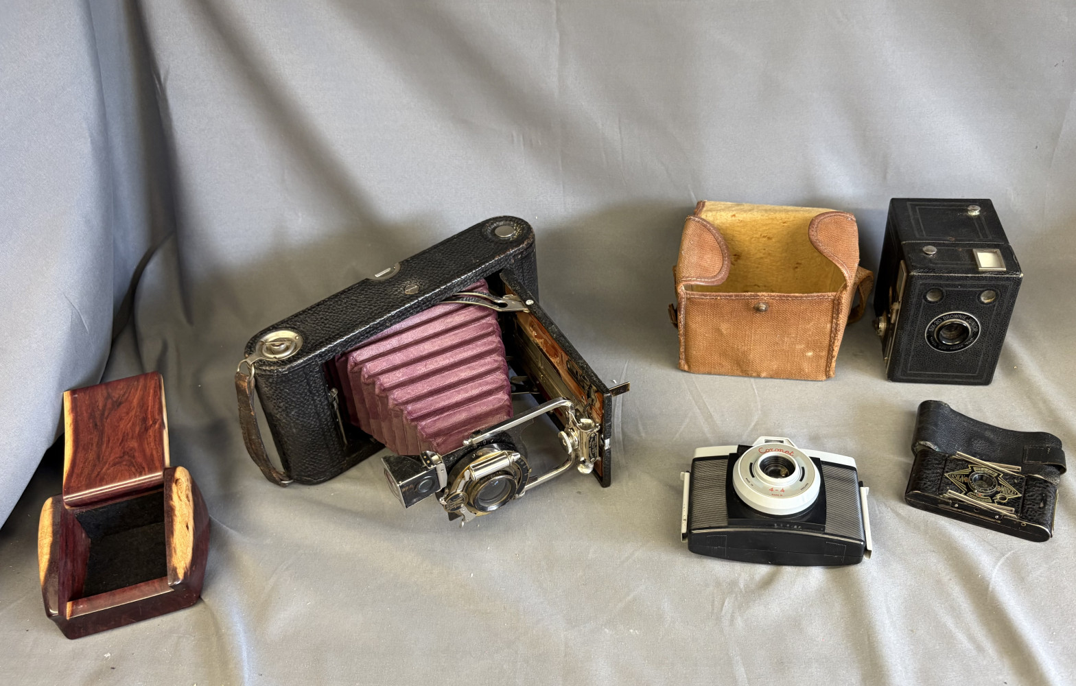 Very rare an Ensign Midget miniature folding roll-film camera, two other antique cameras, vintage camera and wooden box