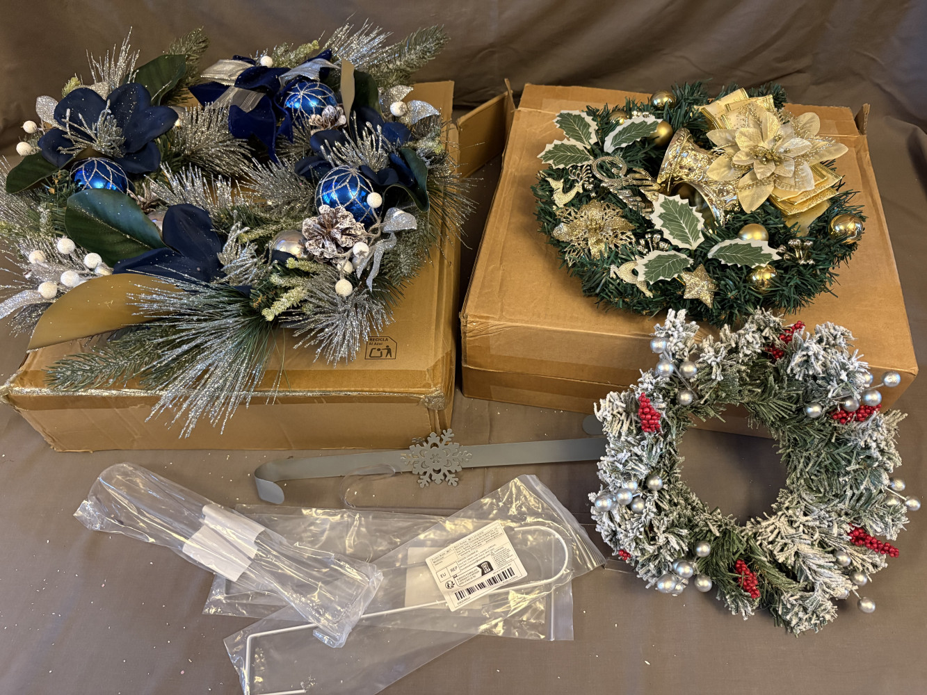 Three Christmas wreaths and hook