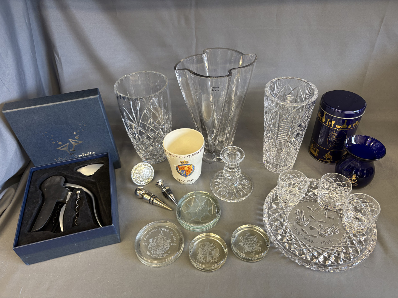 Large crystal and glass vases, paperweights, crystal Christmas plate, bottle opener, Bristol blue vase, and drink related items