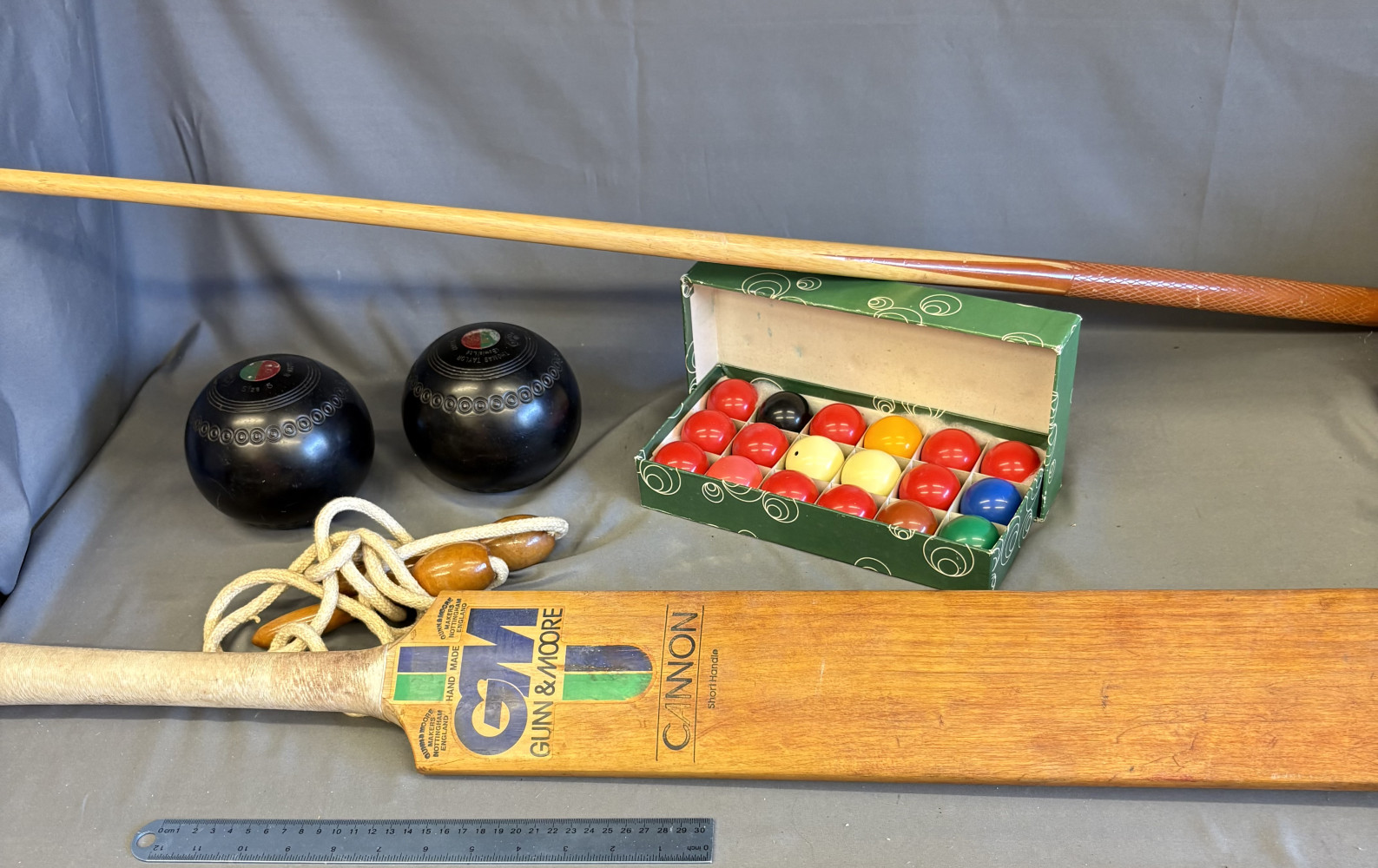 Snooker balls, skipping rope, bowls, cricket bat and child’s que