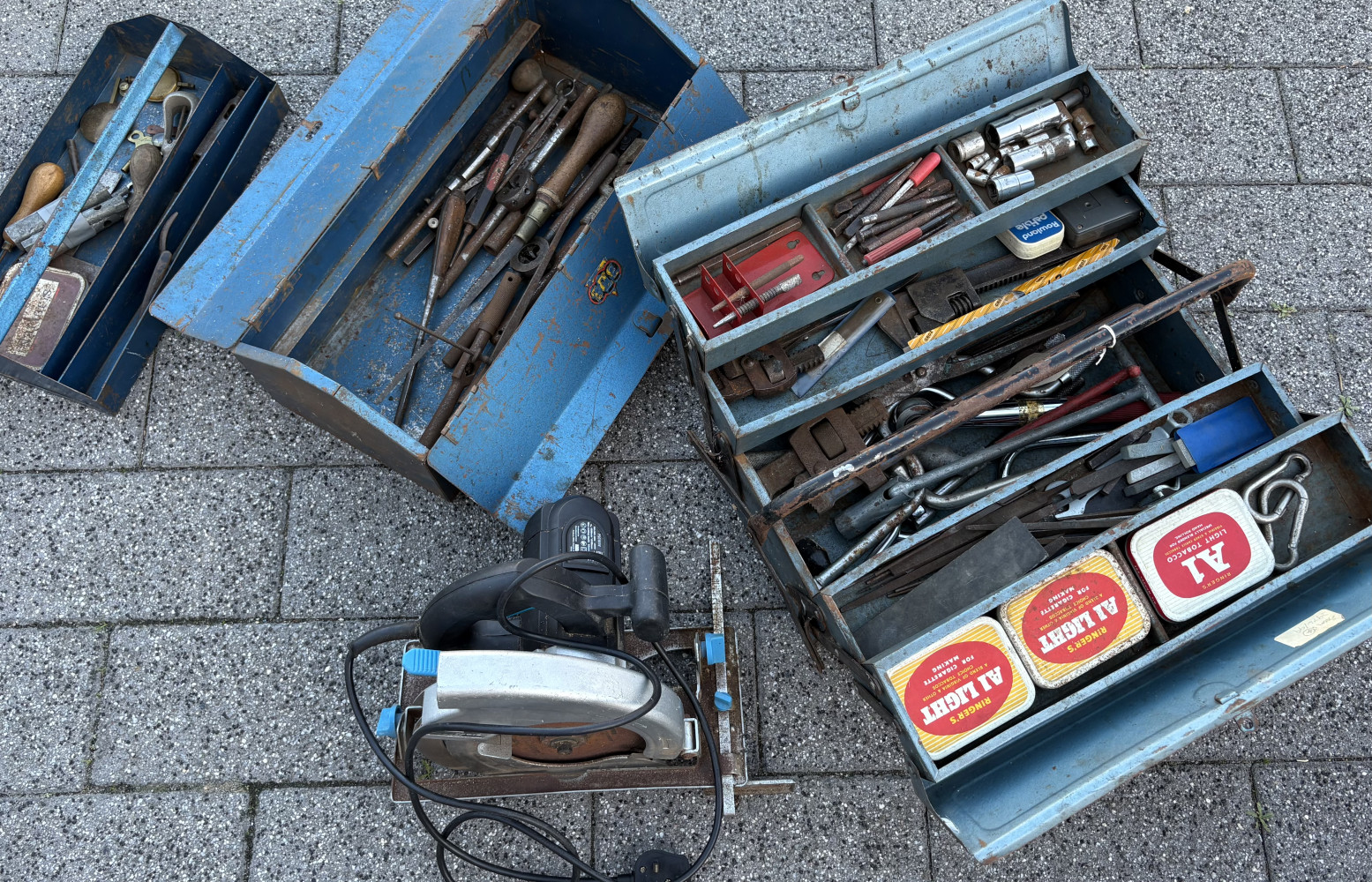 Mechanical and Engineering tools in metal tool boxes and electric saw