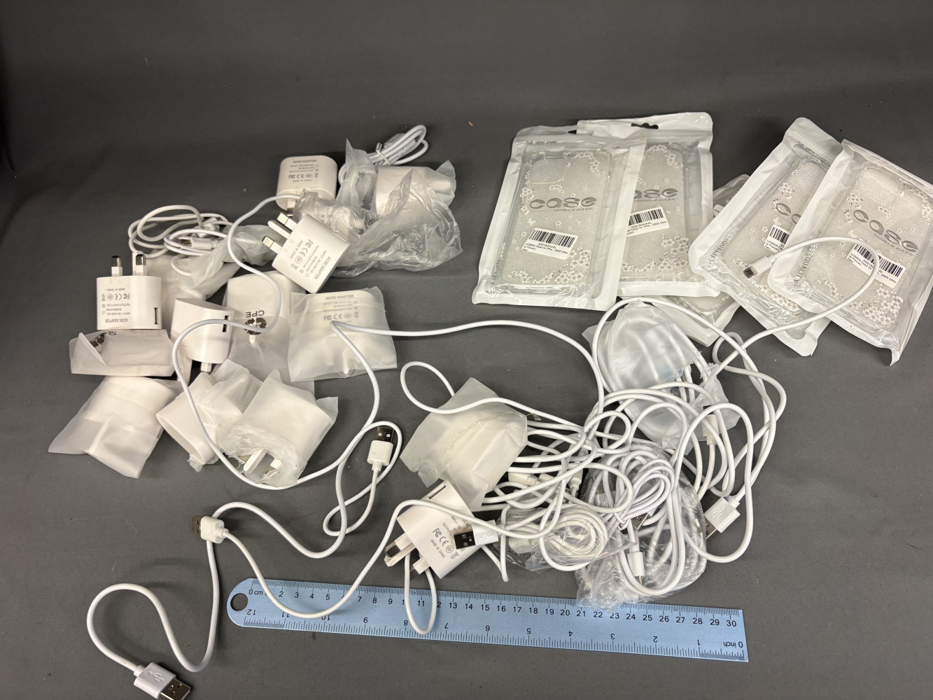 Approx 15 USB Plugs, 15 USB charging cables and 5 screen protectors
