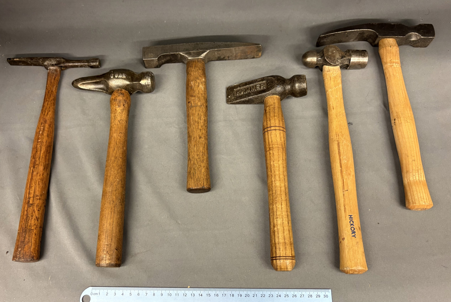 Six vintage hammers with wooden handles