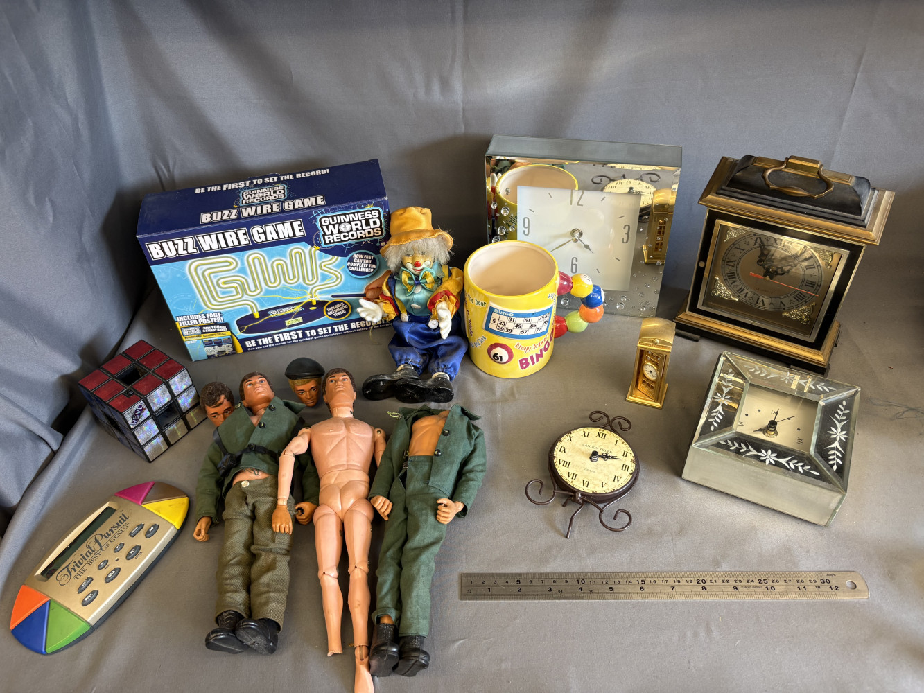 Mixed toys including action men figure and mixed clocks