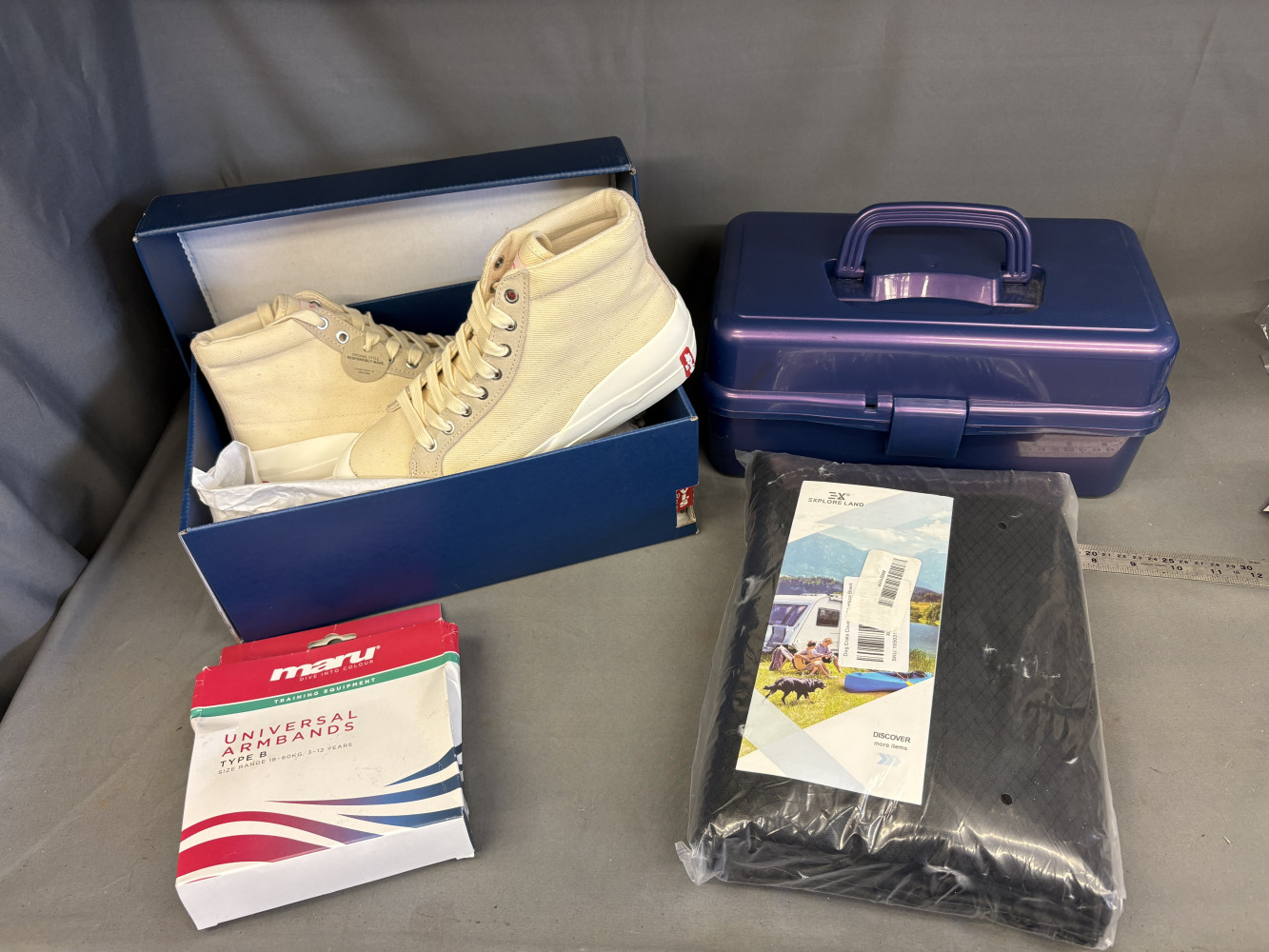 New pair of Levi’s shoes, make up box, arm bands and new camping dog crate cover