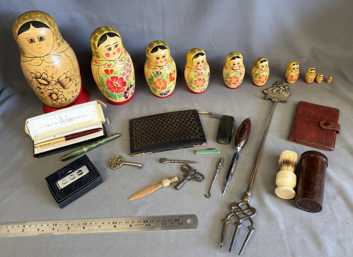 Mixed collectables including large set of Russian dolls two have splits on them,